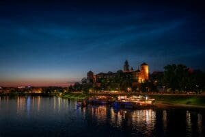 A lake with boats in it and a city in the background